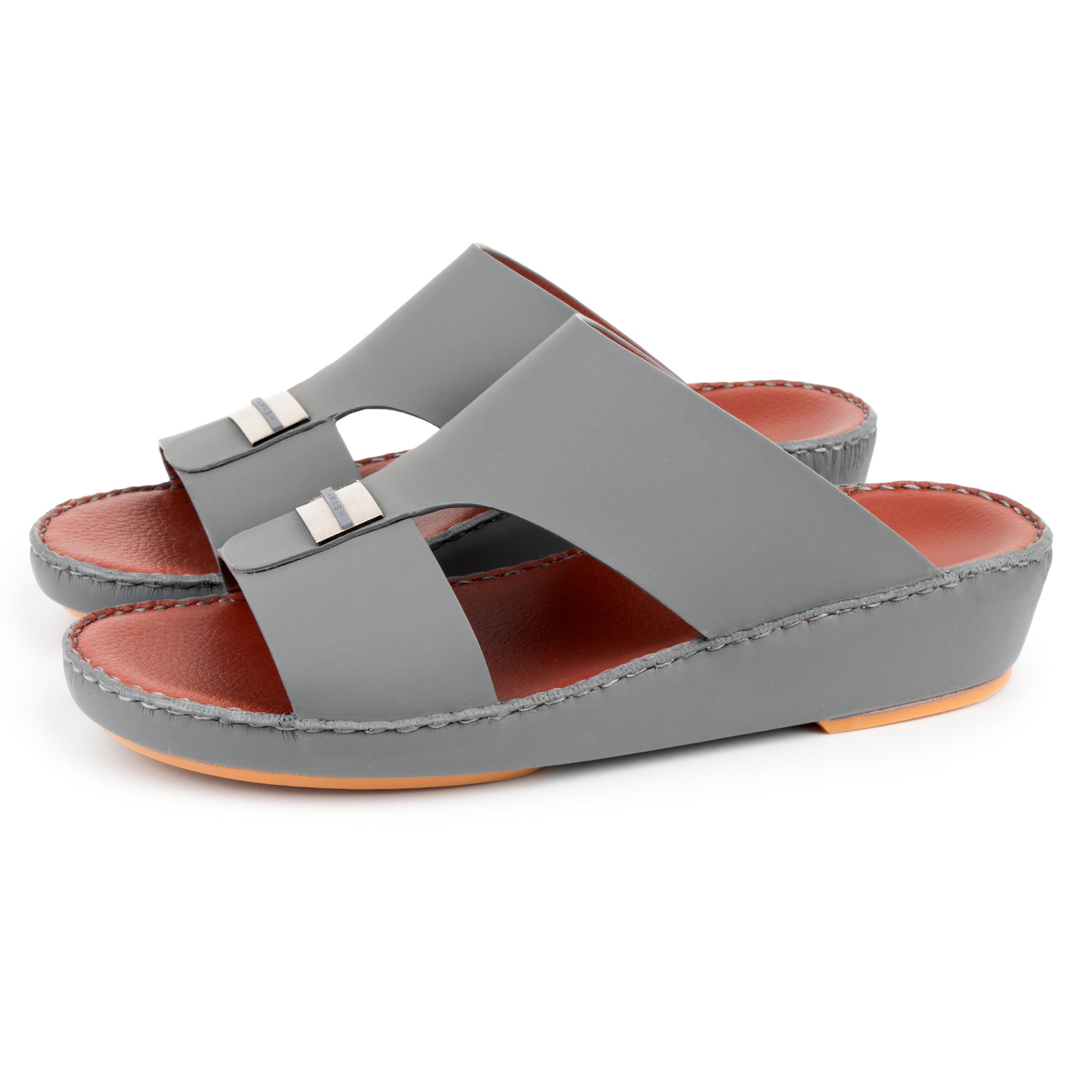 White kandura paired with grey men sandal – Gulf lifestyle look